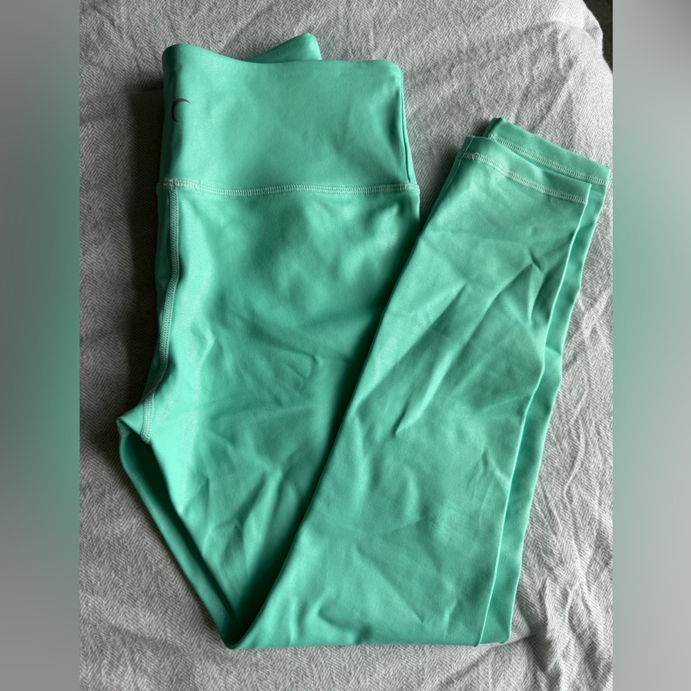 Turquoise, metallic light and tights. Size 4. Never worn